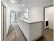 Upstairs hallway with a laundry room and open doorways at 3671 Salvia Dr, Buford, GA 30519