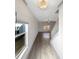 Hallway with natural light, leading to a staircase and living area at 3671 Salvia Dr, Buford, GA 30519