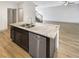 Kitchen island with granite countertop, stainless steel sink, and dishwasher, perfect for meal prep at 3671 Salvia Dr, Buford, GA 30519