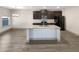 Modern kitchen featuring granite countertops, stainless steel appliances, and ample cabinet space at 3671 Salvia Dr, Buford, GA 30519