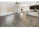 Open-concept living space connecting kitchen with island and living room with large window at 3671 Salvia Dr, Buford, GA 30519
