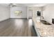 Bright, open-concept living space with hardwood floors, neutral paint, and natural light at 3671 Salvia Dr, Buford, GA 30519