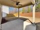 Covered patio with a ceiling fan, offering a relaxing outdoor space and view of the backyard at 3671 Salvia Dr, Buford, GA 30519