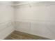 Empty walk-in closet featuring wire shelving and neutral carpet at 3671 Salvia Dr, Buford, GA 30519