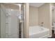 Bathroom with a walk in shower, and large soaker tub at 117 Oliver Dr, Locust Grove, GA 30248