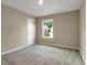 Bedroom with natural light and neutral carpet at 117 Oliver Dr, Locust Grove, GA 30248