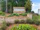 Stone entrance sign with beautiful landscaping at 117 Oliver Dr, Locust Grove, GA 30248