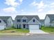 Two-story home featuring manicured lawn and a two-car garage at 117 Oliver Dr, Locust Grove, GA 30248