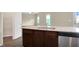 Kitchen island overlooking living room with granite countertops at 117 Oliver Dr, Locust Grove, GA 30248