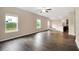 Spacious living room with wood floors, neutral walls, and abundant natural light at 117 Oliver Dr, Locust Grove, GA 30248