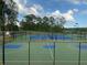 Outdoor tennis and basketball courts in a fenced community area at 117 Oliver Dr, Locust Grove, GA 30248