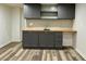 A finished basement features grey cabinets, a wooden countertop and stylish flooring at 4222 Castle Pines Ct, Tucker, GA 30084