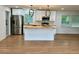 Bright kitchen featuring a butcher block island, stainless steel appliances, and modern pendant lighting at 4222 Castle Pines Ct, Tucker, GA 30084