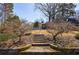 Spacious backyard with stone stairs and lush landscaping, creating a picturesque and inviting outdoor space at 1110 Vernon Springs Ct, Atlanta, GA 30327