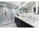 Upscale bathroom with sleek black vanity, dual sinks, marble counters, and a luxurious walk-in glass shower at 1110 Vernon Springs Ct, Atlanta, GA 30327