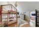 Adorable bedroom with custom canopy bed, whimsical chandelier, and hardwood floors for a cozy, magical space at 1110 Vernon Springs Ct, Atlanta, GA 30327