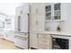 Bright kitchen with white cabinets, and modern appliances including a wine fridge and beverage cooler at 1110 Vernon Springs Ct, Atlanta, GA 30327