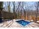 Secluded outdoor spa and lounge area with wooden decking and wooded views at 1110 Vernon Springs Ct, Atlanta, GA 30327