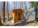 Backyard features a sauna and outbuildings perfect for relaxation and hobbies in a private wooded setting at 1110 Vernon Springs Ct, Atlanta, GA 30327