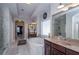 Bright bathroom featuring marble floors, soaking tub, double vanity, and a large, glass enclosed shower at 2480 Copper Mill Trl, Cumming, GA 30041