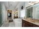 Bright bathroom featuring a large soaking tub, double vanity, and walk-in shower with marble tiling at 2480 Copper Mill Trl, Cumming, GA 30041