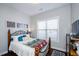 Cozy bedroom with a dark carpet, full bed, and bright window at 2480 Copper Mill Trl, Cumming, GA 30041