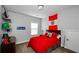 Bedroom decorated with a Peru flag, desk, shelves, and large window at 2480 Copper Mill Trl, Cumming, GA 30041