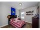 Bedroom decorated with an Idaho flag, desk, shelves, and large window at 2480 Copper Mill Trl, Cumming, GA 30041