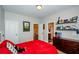 Bedroom featuring a double bed and decorated shelving, with doors providing access to other areas at 2480 Copper Mill Trl, Cumming, GA 30041