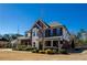 Charming home featuring a brick facade, bay windows, and well-maintained landscaping at 2480 Copper Mill Trl, Cumming, GA 30041