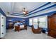 Spacious main bedroom with tray ceilings, large windows, and an ensuite bathroom at 2480 Copper Mill Trl, Cumming, GA 30041