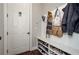 Well-organized mudroom with built-in bench and shoe storage at 2480 Copper Mill Trl, Cumming, GA 30041