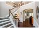 Open staircase with wood treads and white risers leads to the second floor at 2480 Copper Mill Trl, Cumming, GA 30041