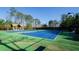 Well-maintained tennis courts surrounded by trees at 2480 Copper Mill Trl, Cumming, GA 30041