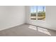 Bedroom featuring a large window for natural light, neutral paint, and soft carpet at 303 Oak View Ln, Dallas, GA 30157