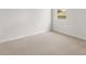 Simple bedroom featuring neutral carpet, light-colored walls, and a small window at 303 Oak View Ln, Dallas, GA 30157