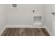 Laundry room includes hardwood floors and hookups for washer and dryer at 303 Oak View Ln, Dallas, GA 30157