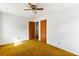 Bedroom featuring a ceiling fan and closet and door access at 3160 Ann Se Rd, Smyrna, GA 30080