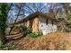 Side view of a house featuring a brick and vinyl facade and small windows at 3160 Ann Se Rd, Smyrna, GA 30080