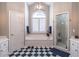 Bright bathroom with tiled floor, a tub, a shower and double sink vanities at 4162 Gateswalk Se Dr, Smyrna, GA 30080