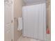 Bathroom shower with white tile and a white shower curtain at 4162 Gateswalk Se Dr, Smyrna, GA 30080