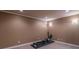 Exercise room with wood flooring, neutral walls, and an rowing machine at 4162 Gateswalk Se Dr, Smyrna, GA 30080