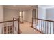 Hallway with carpet runner, wood trim and staircase at 4162 Gateswalk Se Dr, Smyrna, GA 30080