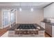 Kitchen island features granite countertops, gas range and double doors leading to the sunroom at 4162 Gateswalk Se Dr, Smyrna, GA 30080