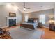 Main bedroom featuring a bed, fireplace, wood floors and vaulted ceiling at 4162 Gateswalk Se Dr, Smyrna, GA 30080