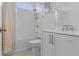 Bright bathroom with white subway tiles and updated vanity with granite counters at 4535 Atley Woods Se Dr, Atlanta, GA 30339