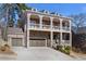 Inviting brick facade with well-manicured landscaping, spacious driveway, and a two-car garage at 4535 Atley Woods Se Dr, Atlanta, GA 30339