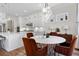 Eat in kitchen area with white cabinets, quartz countertops, and a modern table set at 4535 Atley Woods Se Dr, Atlanta, GA 30339