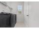 Clean laundry room featuring new appliances and a bright window at 4535 Atley Woods Se Dr, Atlanta, GA 30339