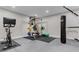 Home workout room with weight equipment, stationary bike, and heavy bag at 4535 Atley Woods Se Dr, Atlanta, GA 30339